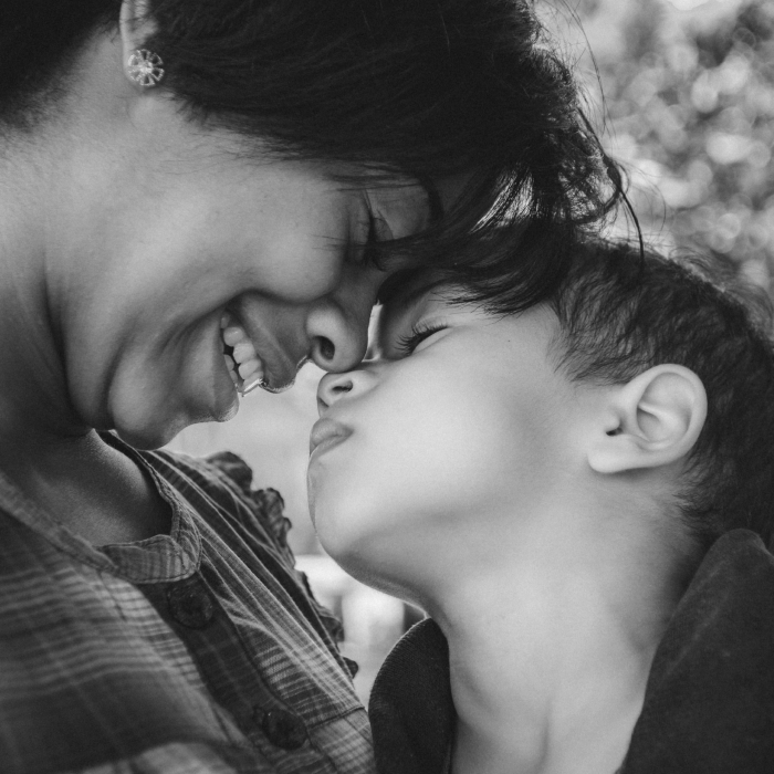 A woman and child embracing: poverty in san diego