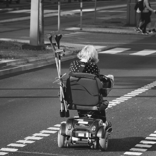 Elderly woman in an electric wheelchair
